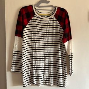 White and black striped tunic style top with Buffalo plaid shoulder accent